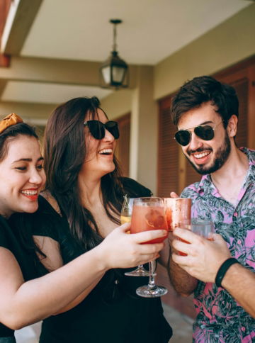 woman in black shirt holding drinking glass